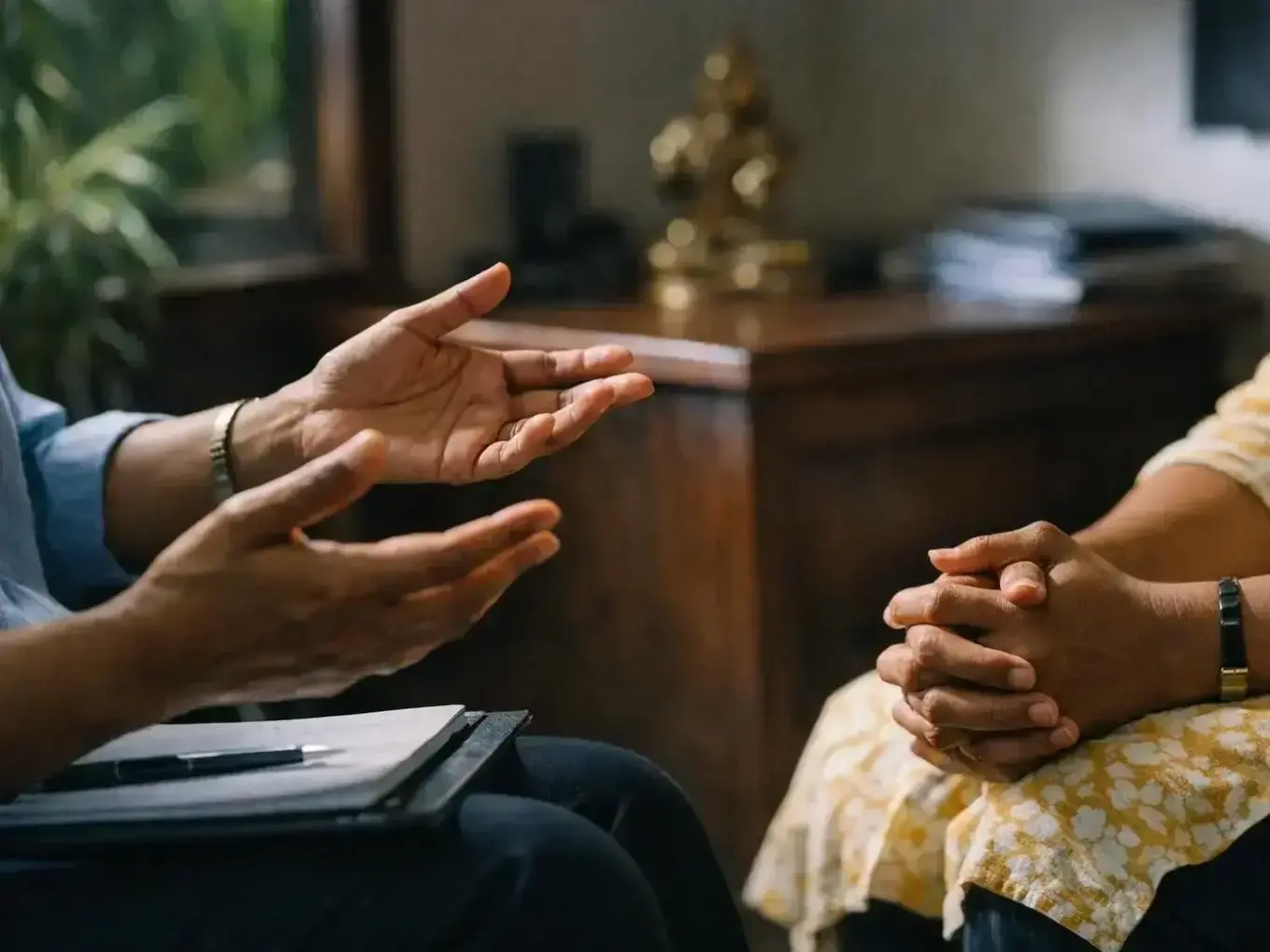 Licensed clinical psychologist with M.Phil qualification discussing personality disorder treatment plan with patient